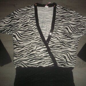 womens black and white sweater.sequin trim.Deep v-neck.size medium